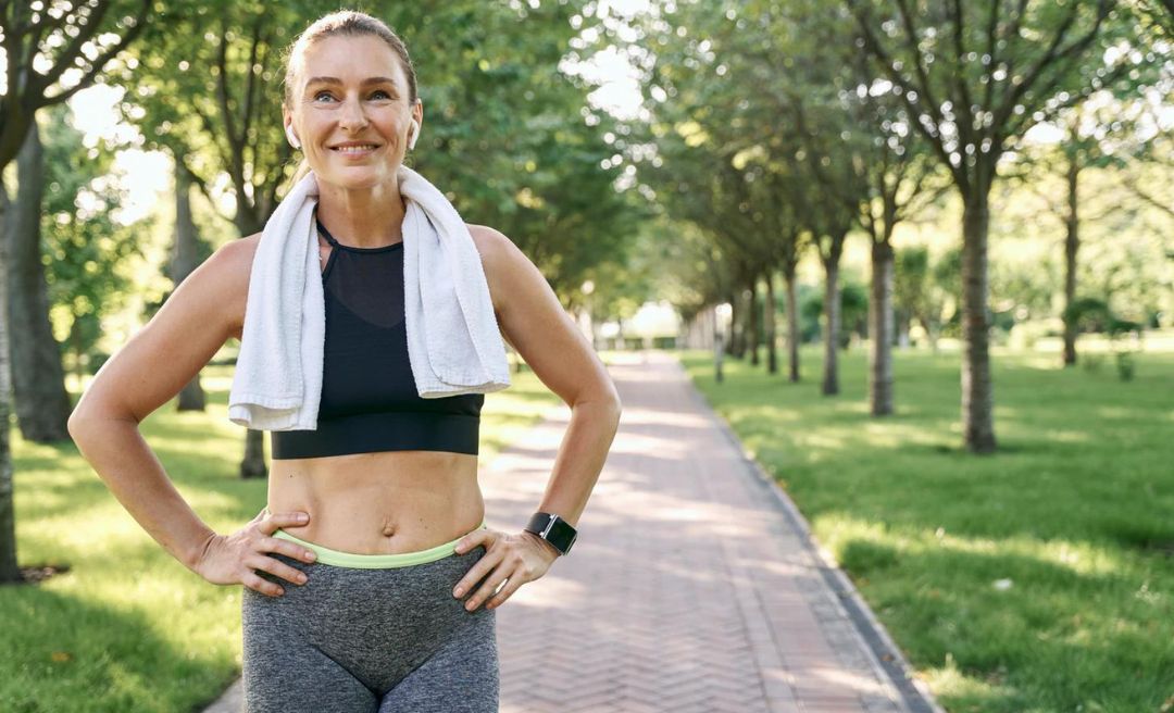 Woman working hard to achieve fitness over 50