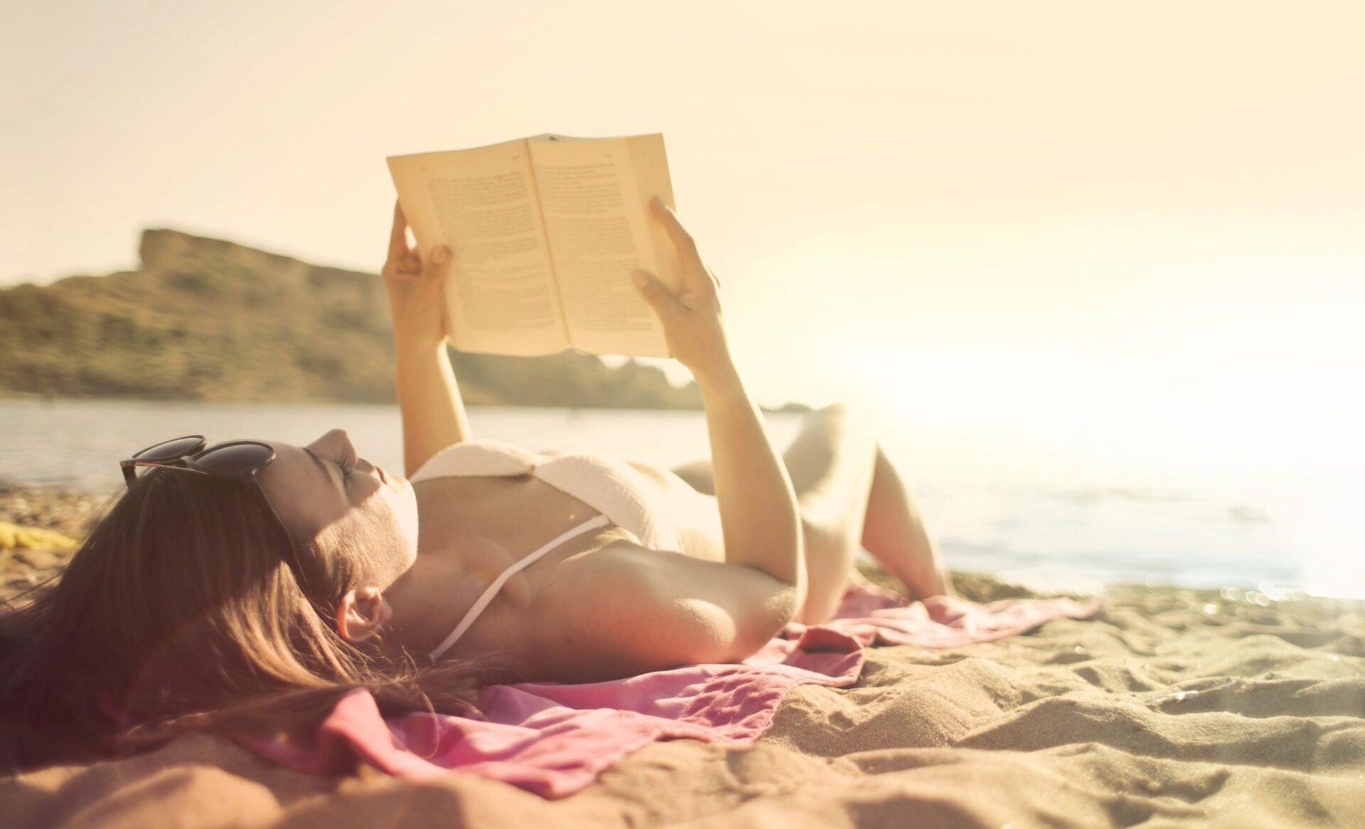 woman reading great books this summer