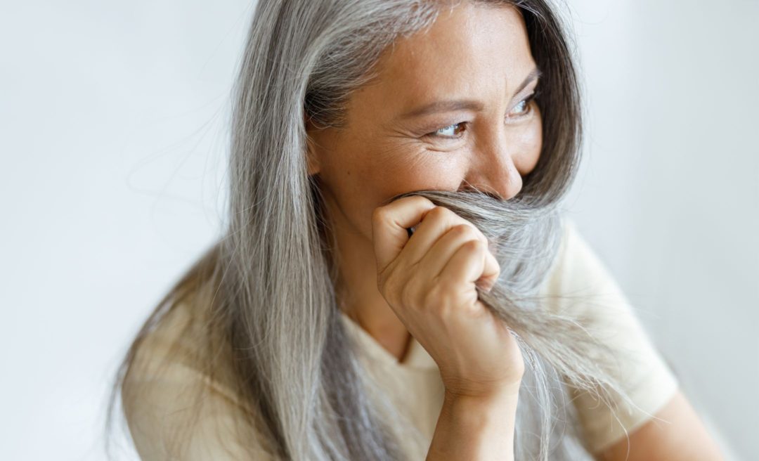 Middle aged woman experiencing hair loss